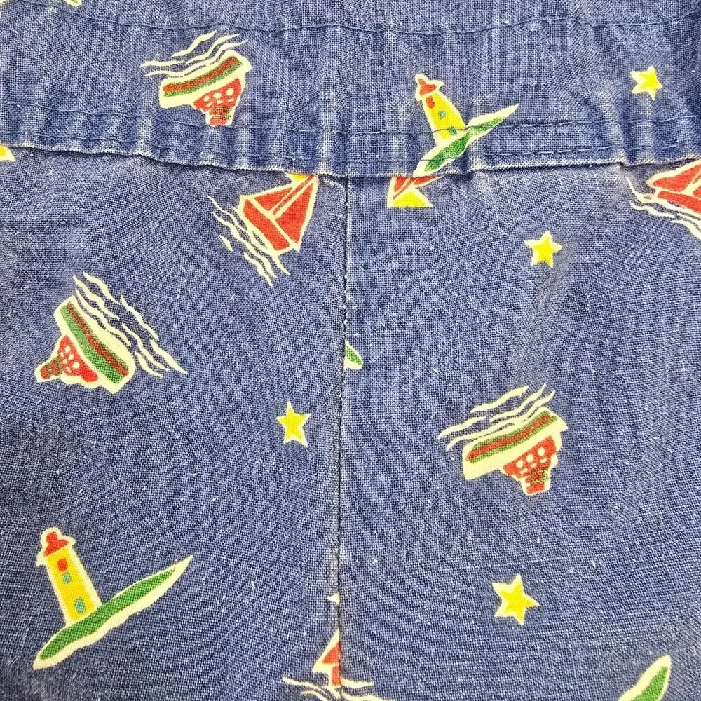 OshKosh B'gosh blue denim overalls with white & red sailboat and star print